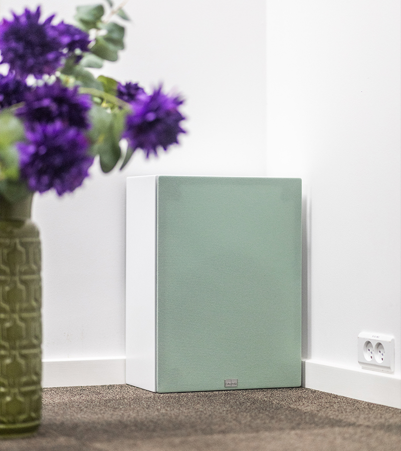 White Lyngdorf BW-2 subwoofer with green Gabriel fabric cover