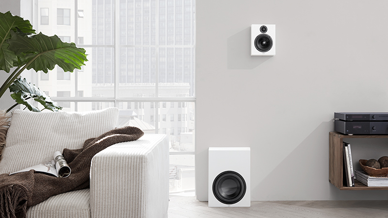 White Lyngdorf BW-2 woofer and MH-2 speaker setup